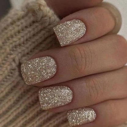 Short Square Nails Covered in Fine Silver Glitter