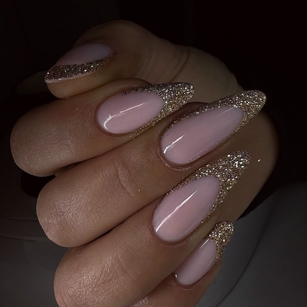 Glossy Pink Almond Nails with Glitter French Tips