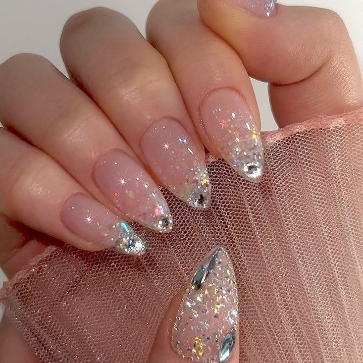 Pink Almond Nails with Sparkling French Tips and Crystal Accents