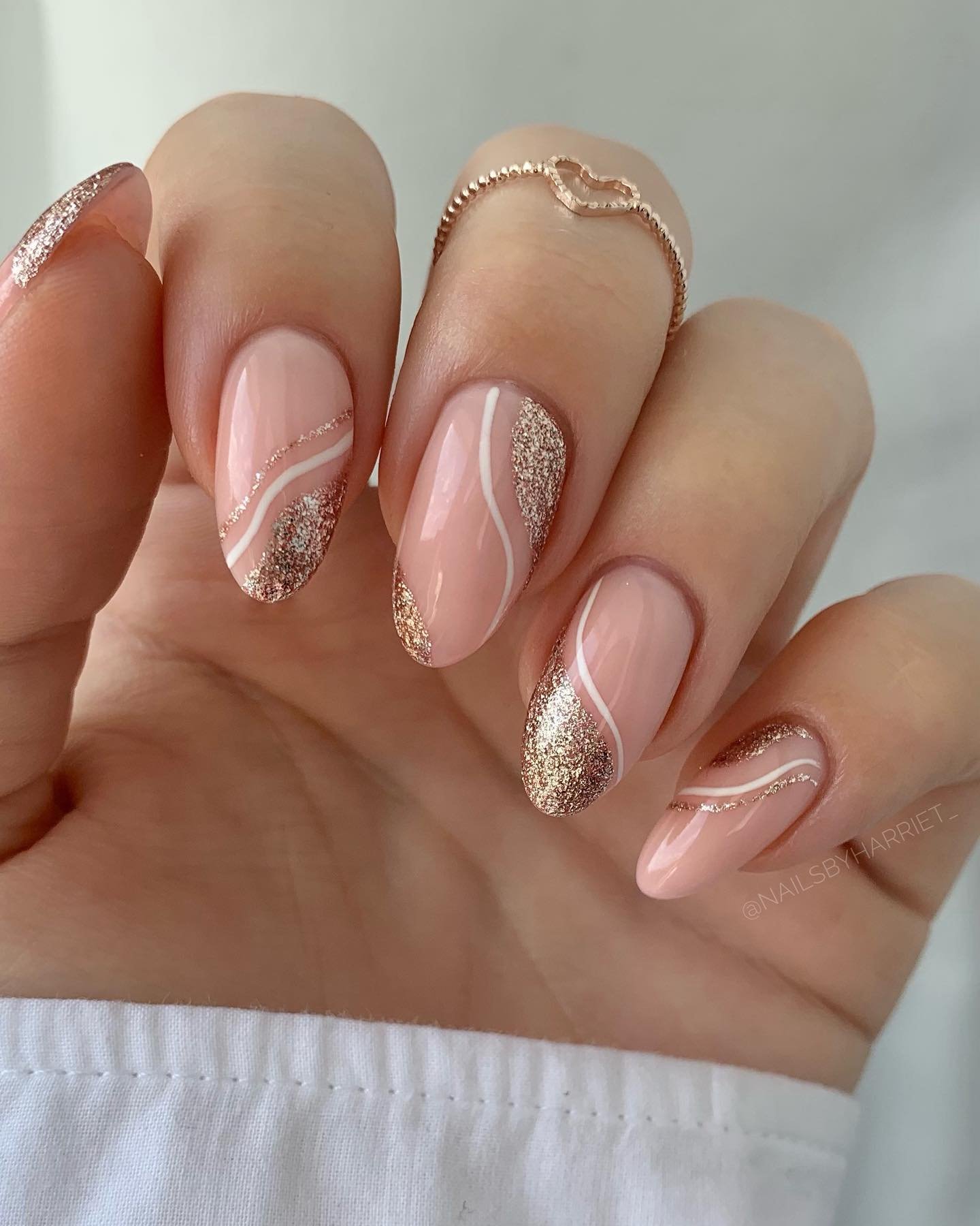 Soft Pink Almond Nails with Glitter Tips and Delicate Details