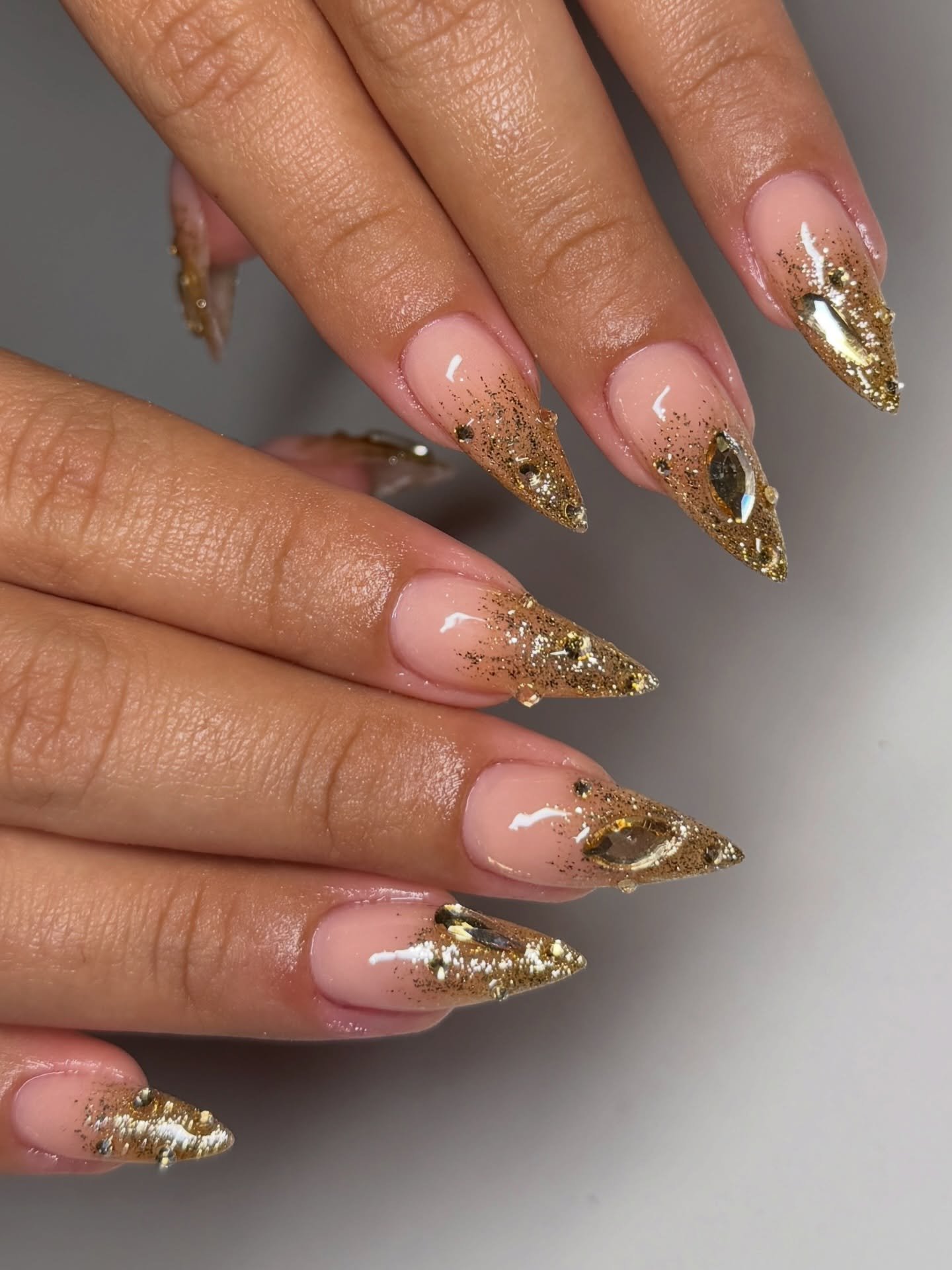 Long Stiletto Nails with Gold Glitter Tips and Crystal Accents