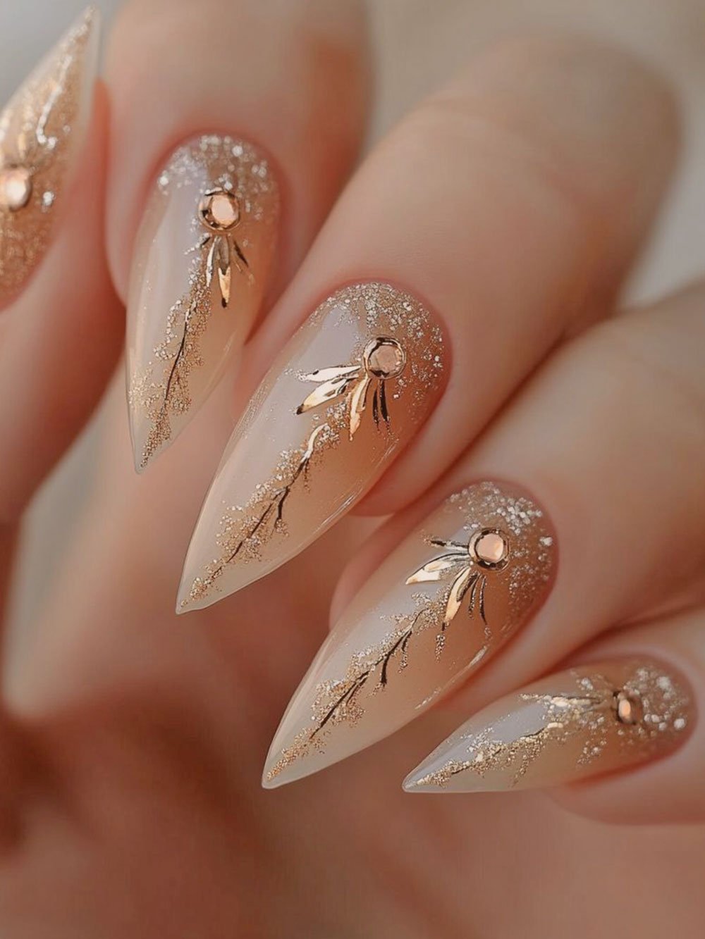 Milky Nude Stiletto Nails with Gold Foil and Rhinestones