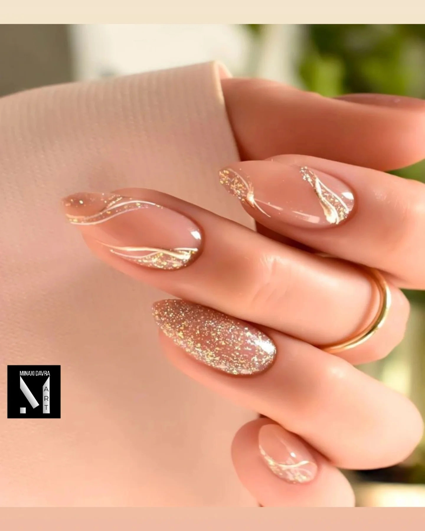 Peachy Nude Almond Nails with Raised Gold-Pink Swirl Details