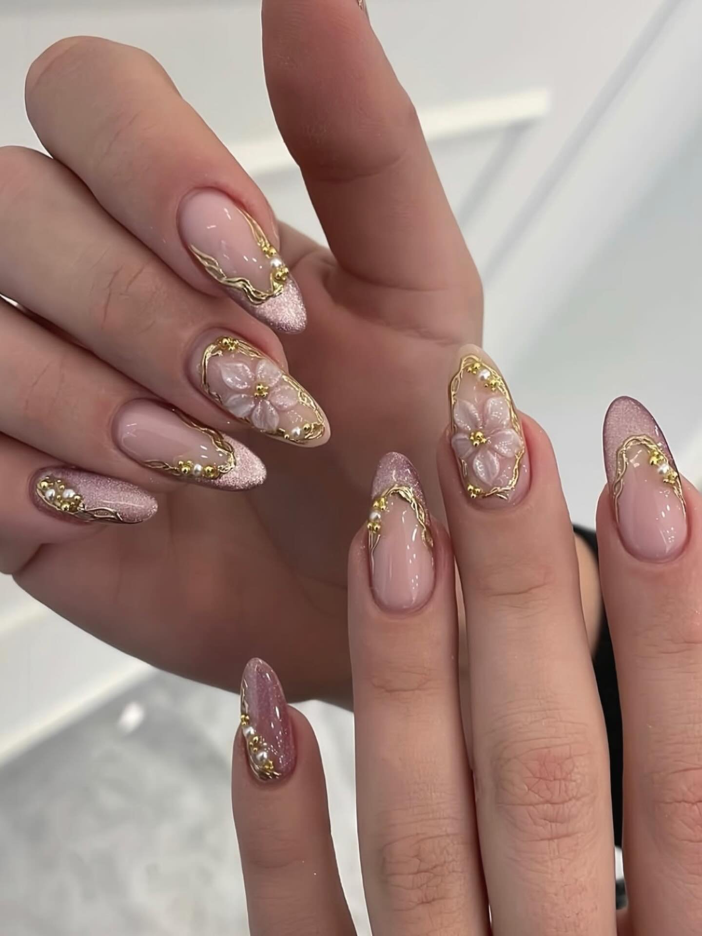 Long Nude Almond Nails with Gold Crystal Embellishments
