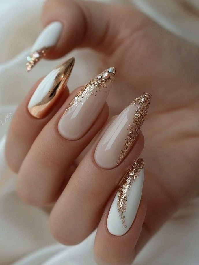 Long Nude Nails with White, Gold, and Glitter Accents