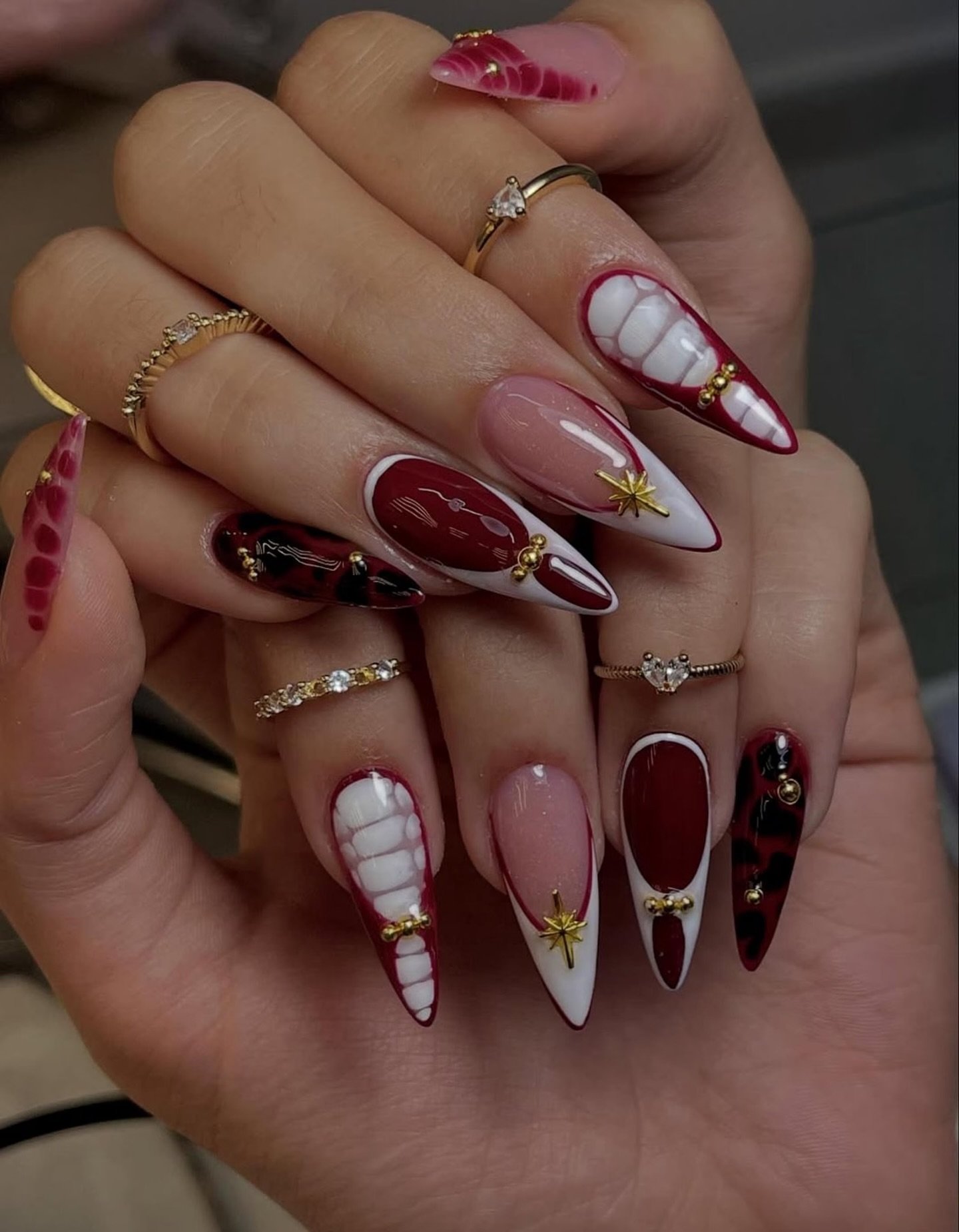 Mixed Blood-Red Stiletto Nails with Nude and White Accents
