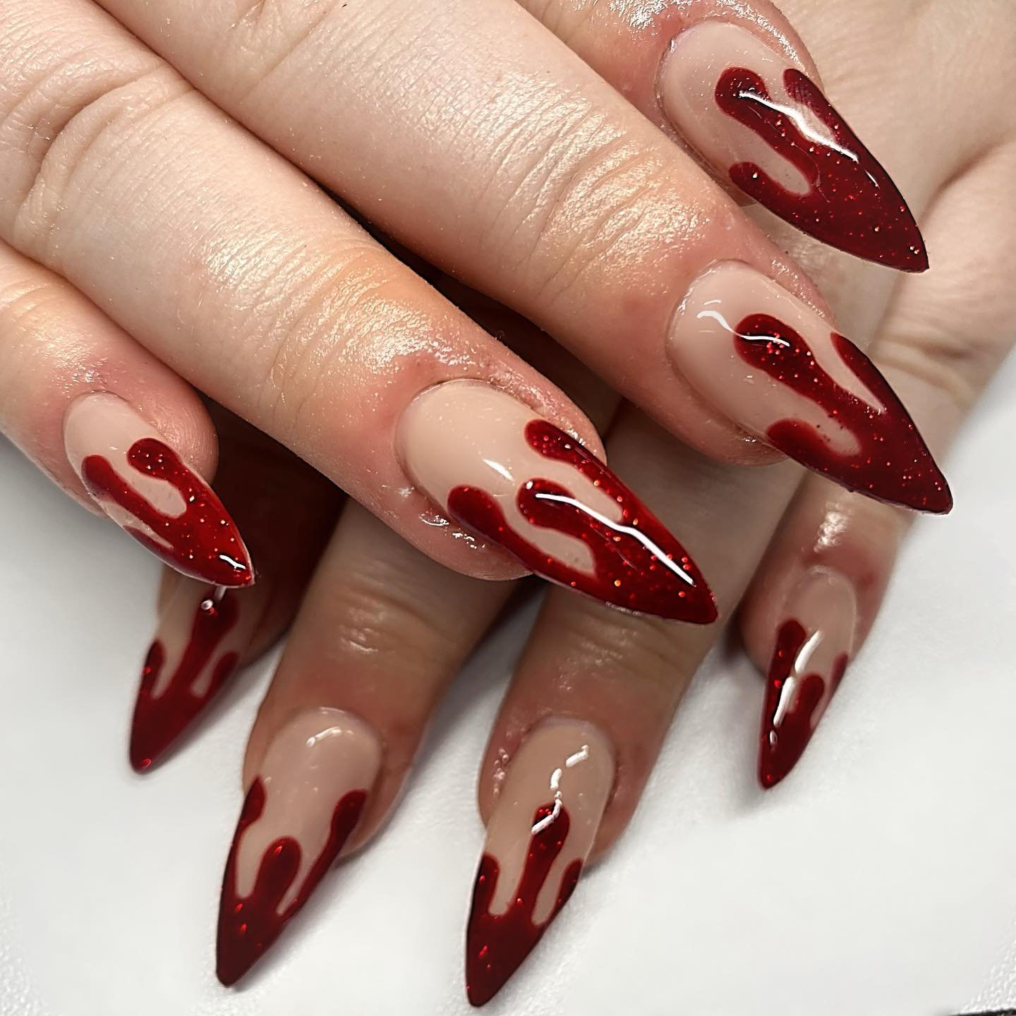 Nude Almond Nails with Deep Red Dripping Tips