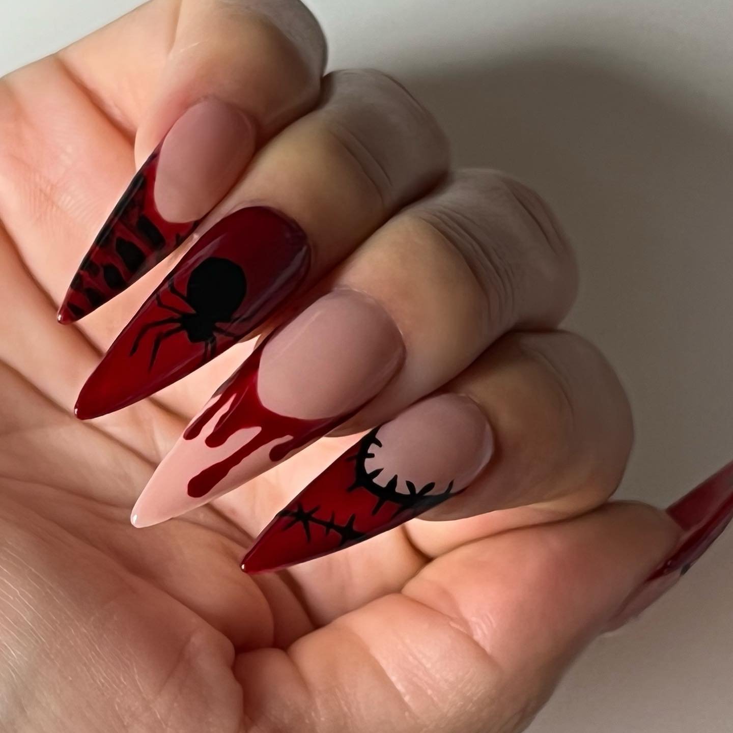 Nude and Blood-Red Stiletto Nails with Spider and Drip Details