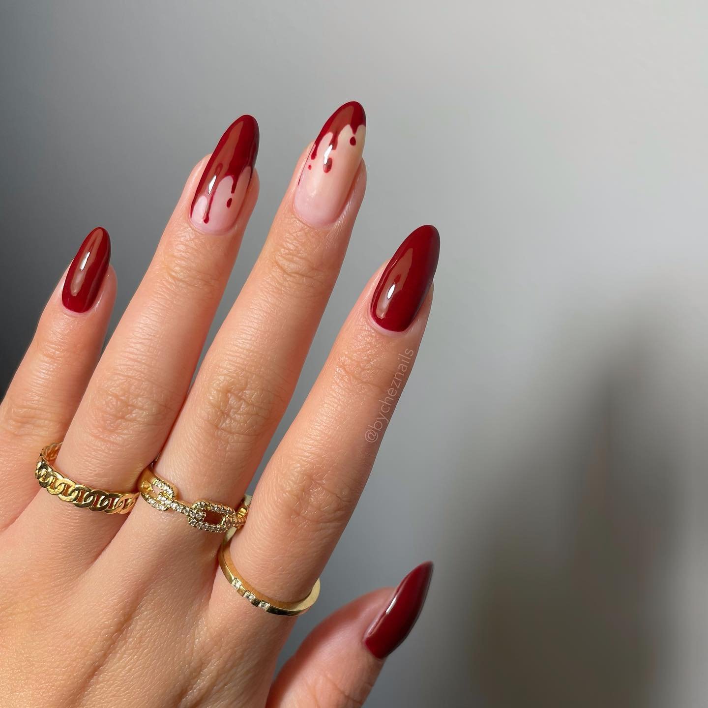 Deep Red Almond Nails with Nude Drip Accents