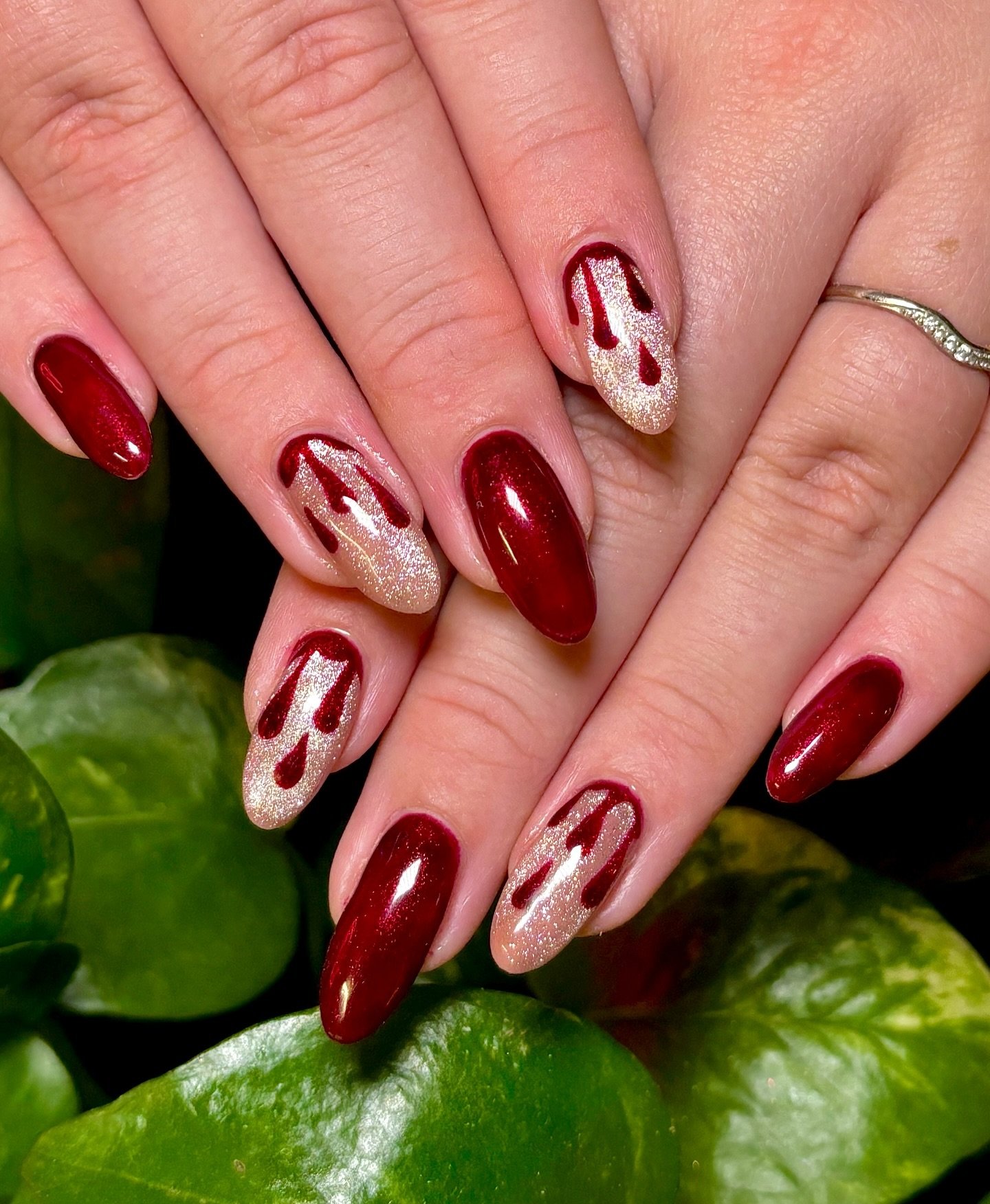 Glossy Red Almond Nails with White Accent Line Art