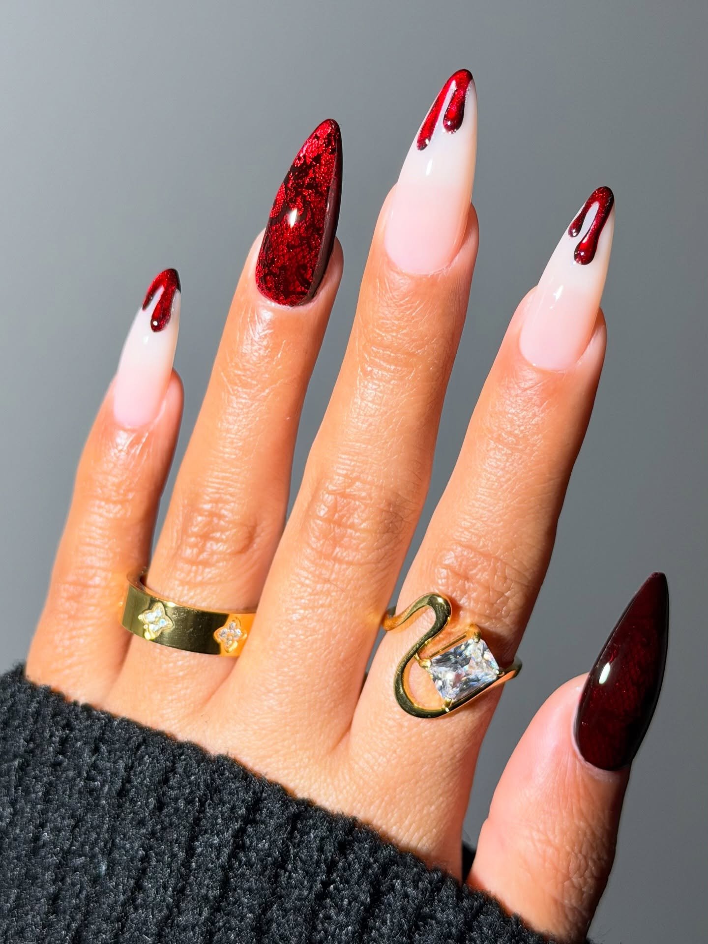 White and Deep Red Almond Nails with Glittered Red Accents