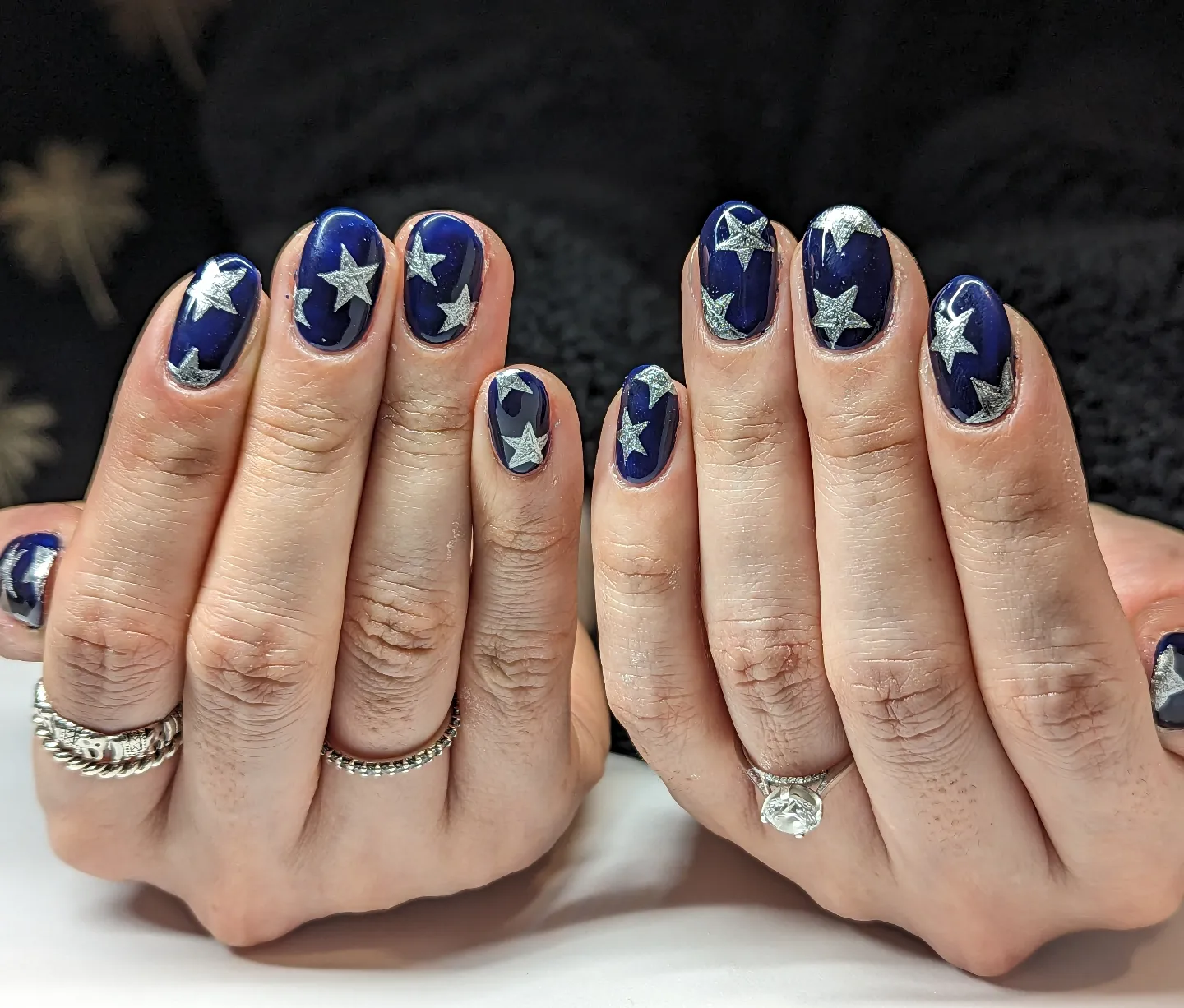 Blue Christmas nails idea 7: Short Navy Blue Nails with White Winter Motifs