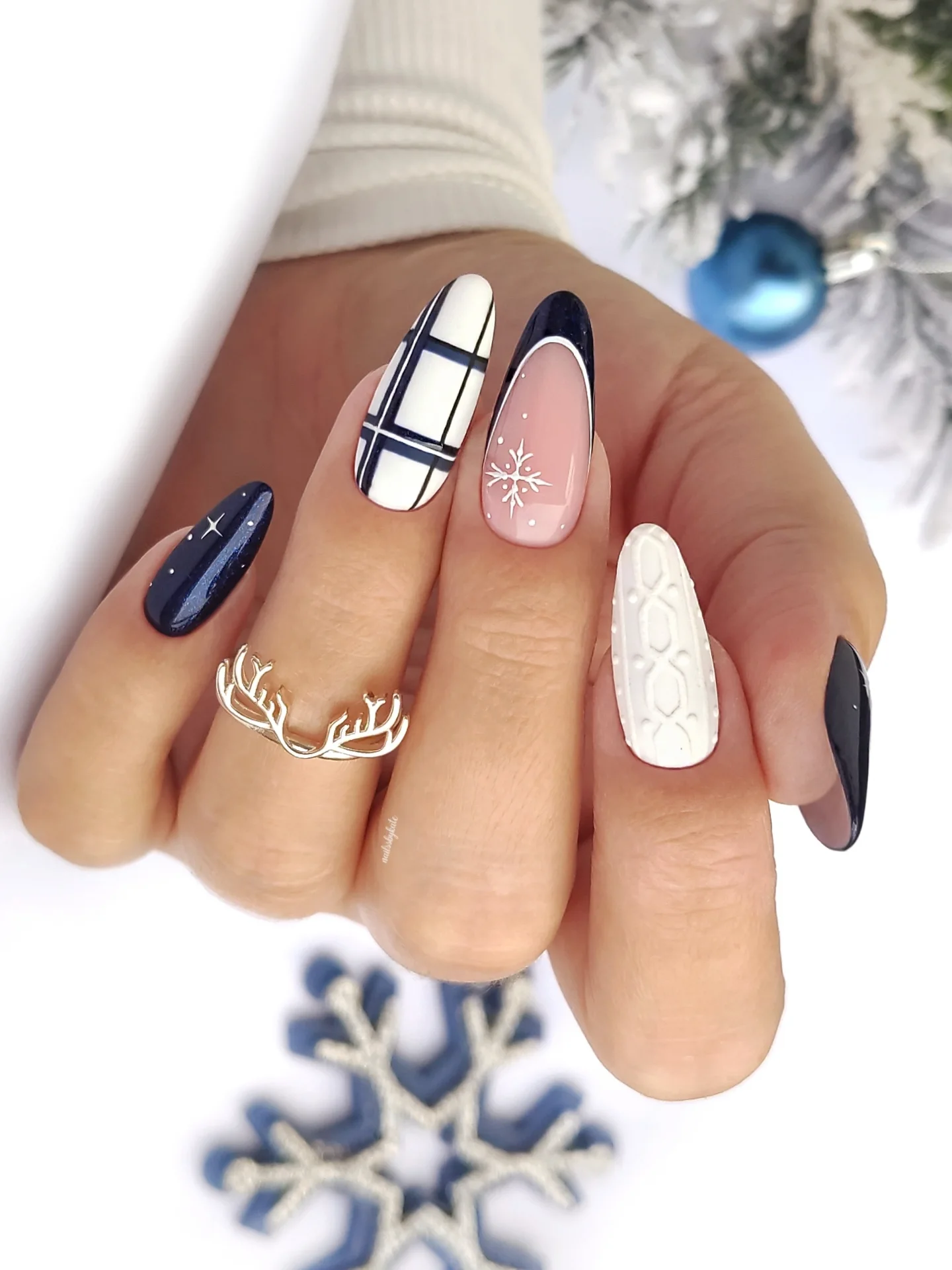 Blue Christmas nails idea 8: Icy Blue Almond Nails with Snowflakes and Glitter Tips