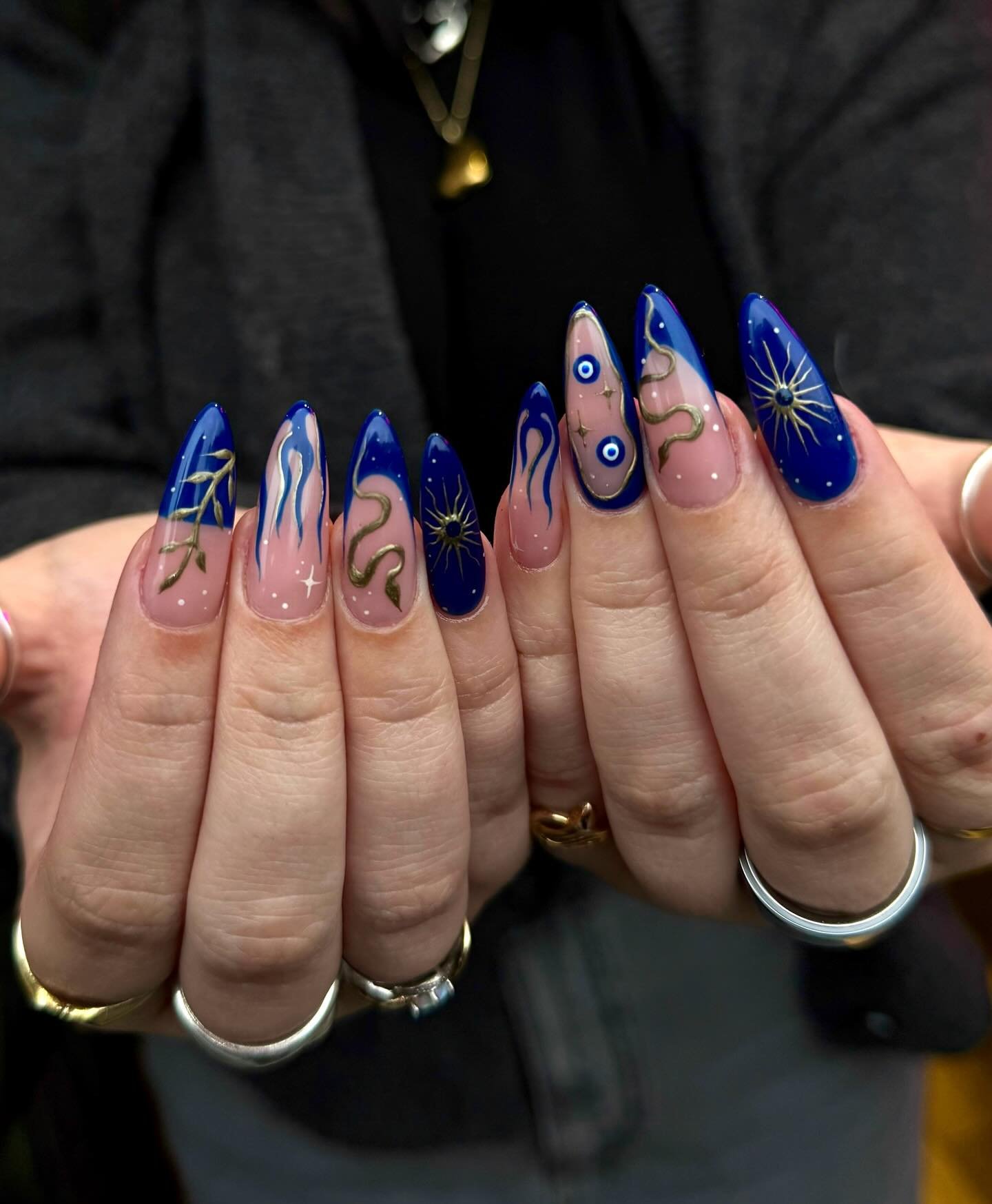 Blue Christmas nails idea 9: Blue French Almond Nails with Winter Line Art