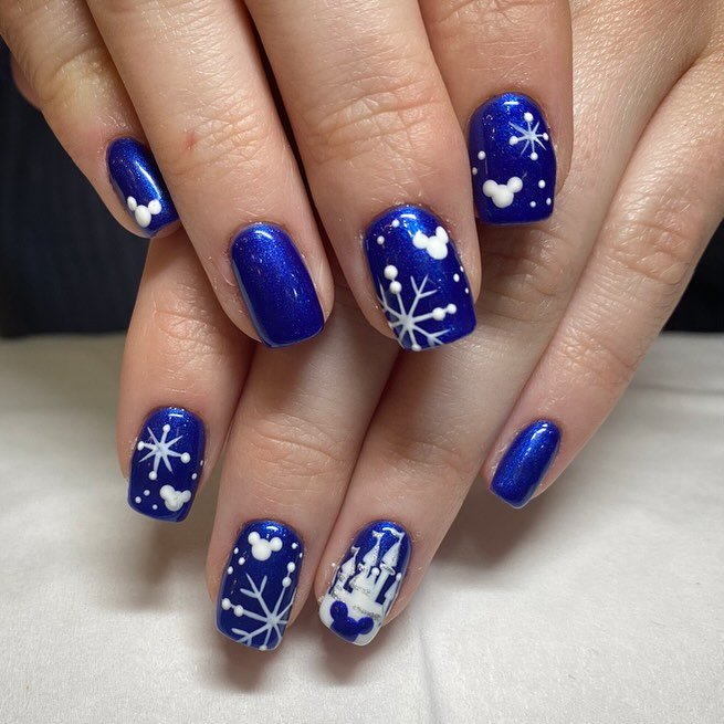 Blue Christmas nails idea 10: Cobalt Blue Short Nails with White Snowflake Details