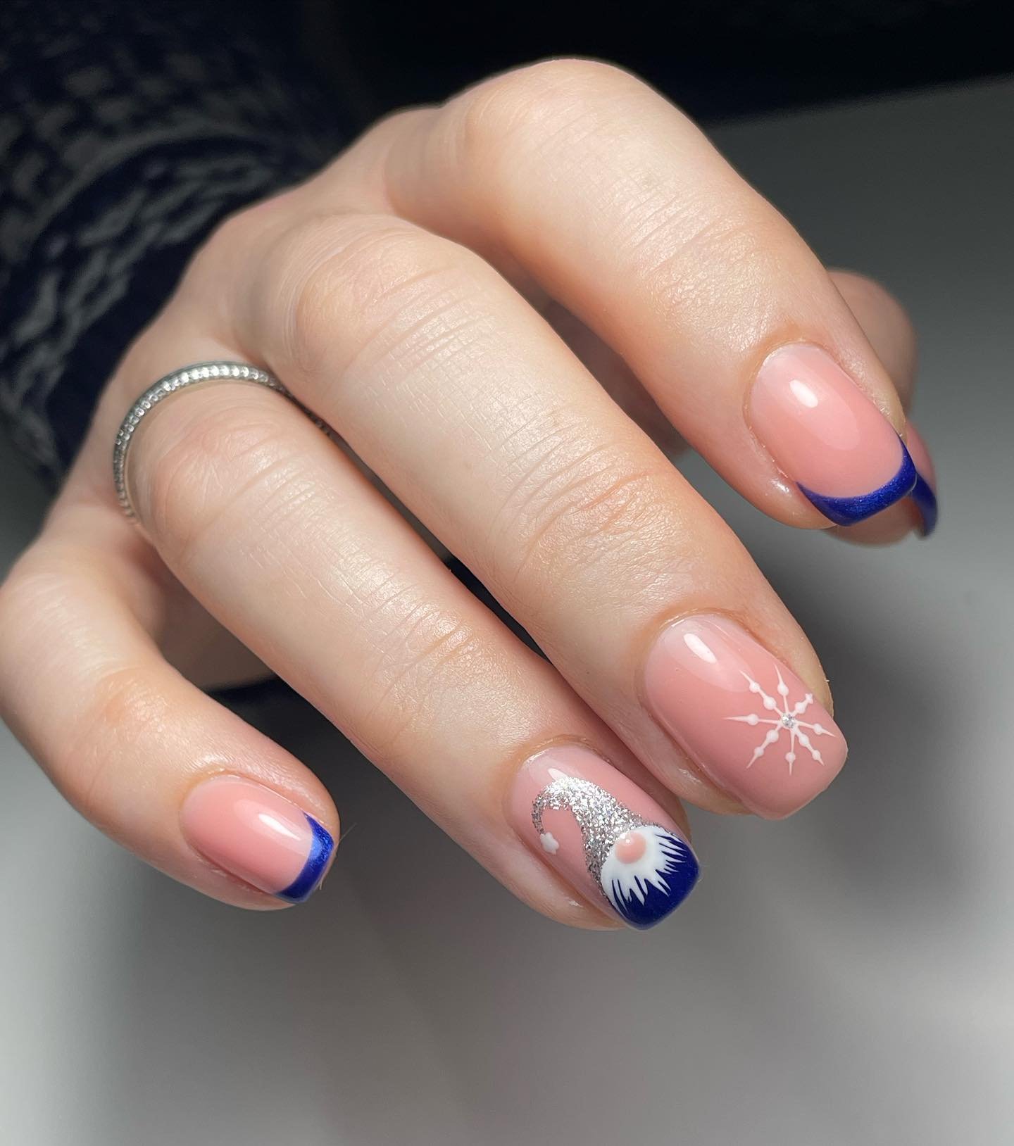 Blue Christmas nails idea 20: Short Pink and Blue French Nails with a Snowflake Accent