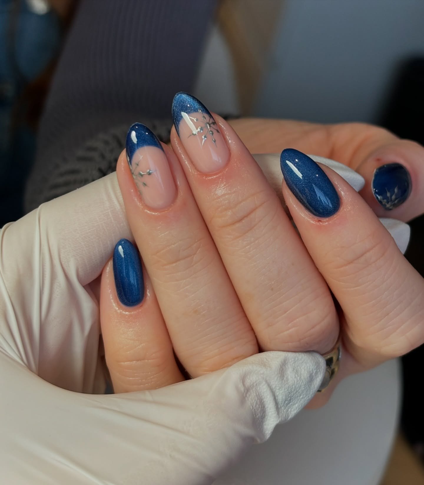 Blue Christmas nails idea 23: Short Blue Almond Nails with White Winter Accents