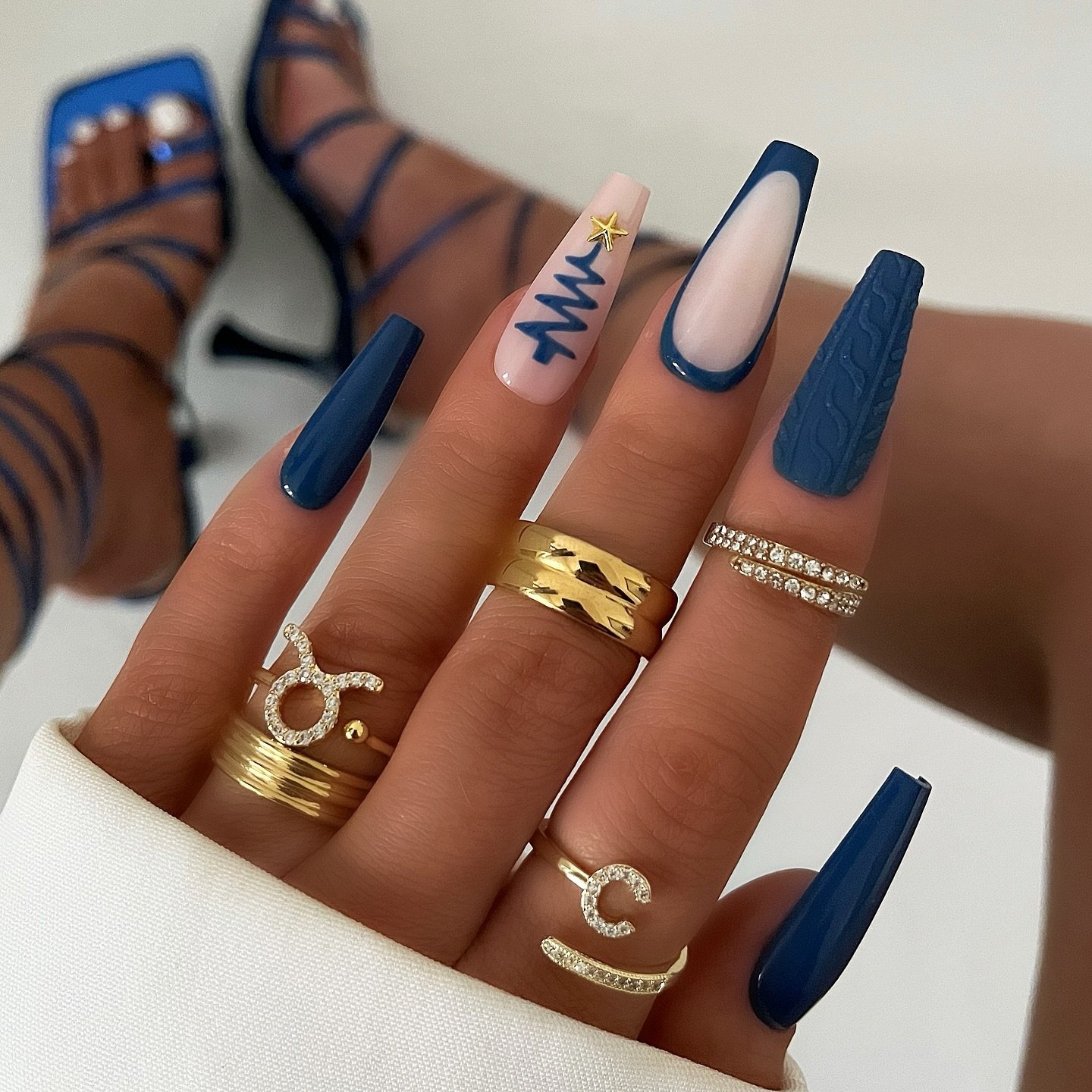 Blue Christmas nails idea 26: Navy French Almond Nails with White Winter Line Art