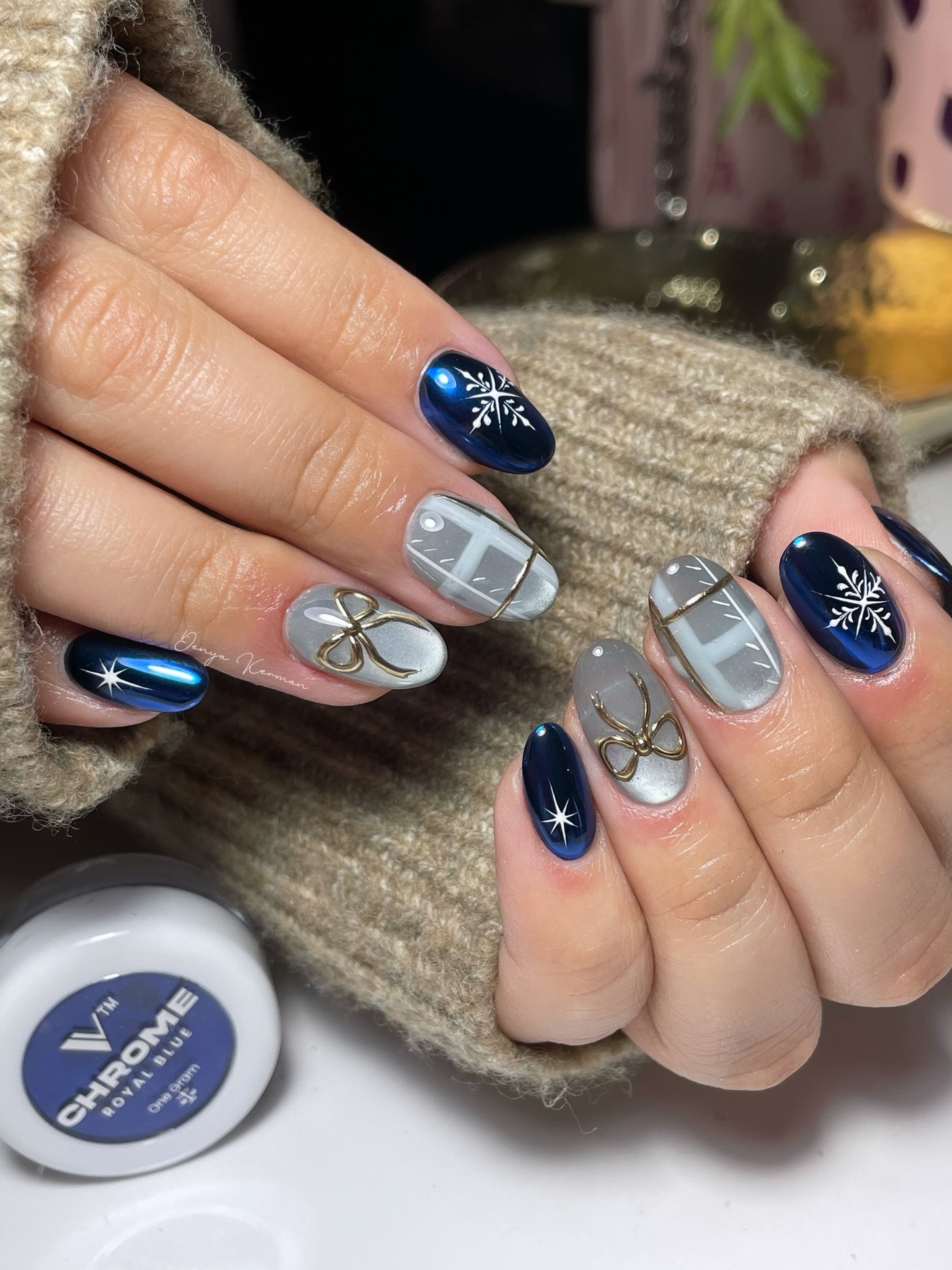Blue Christmas nails idea 33: Navy and Silver Christmas Nails with Snowflakes and Bows