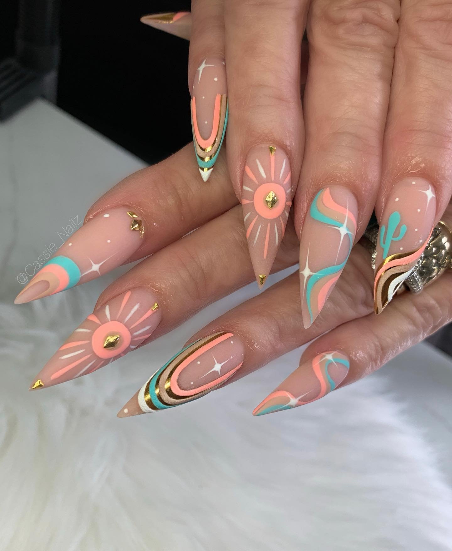 Coral and Turquoise Stiletto Nails with Swirled Accents