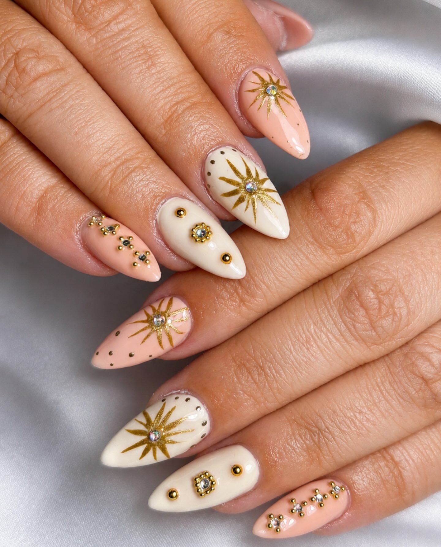 Nude Almond Nails with Daisy-Like Floral Details