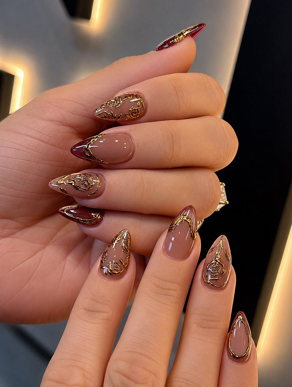 Brown and Bronze Stiletto Nails with Glitter Accents
