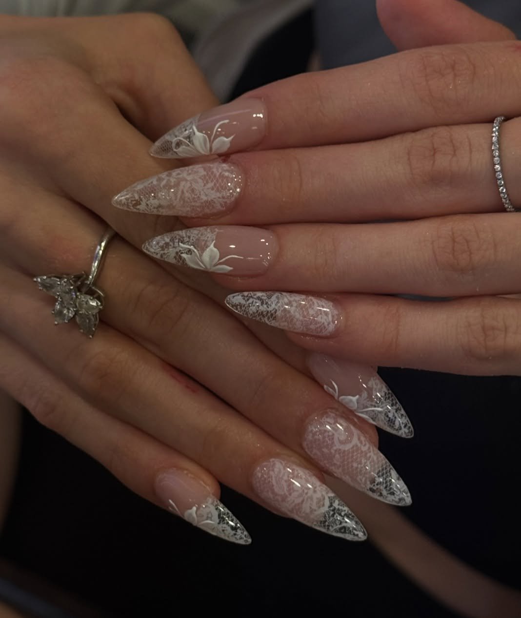 Long Glittery Stiletto Nails with a Sheer Base