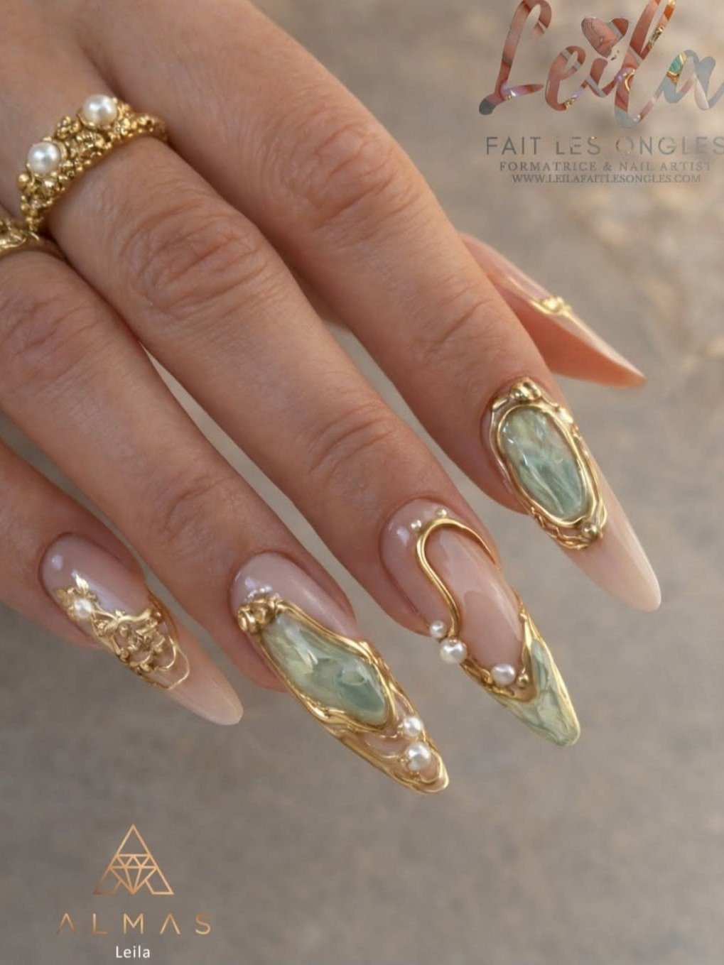Sheer Nude Almond Nails with Gold and Pale Blue Accents