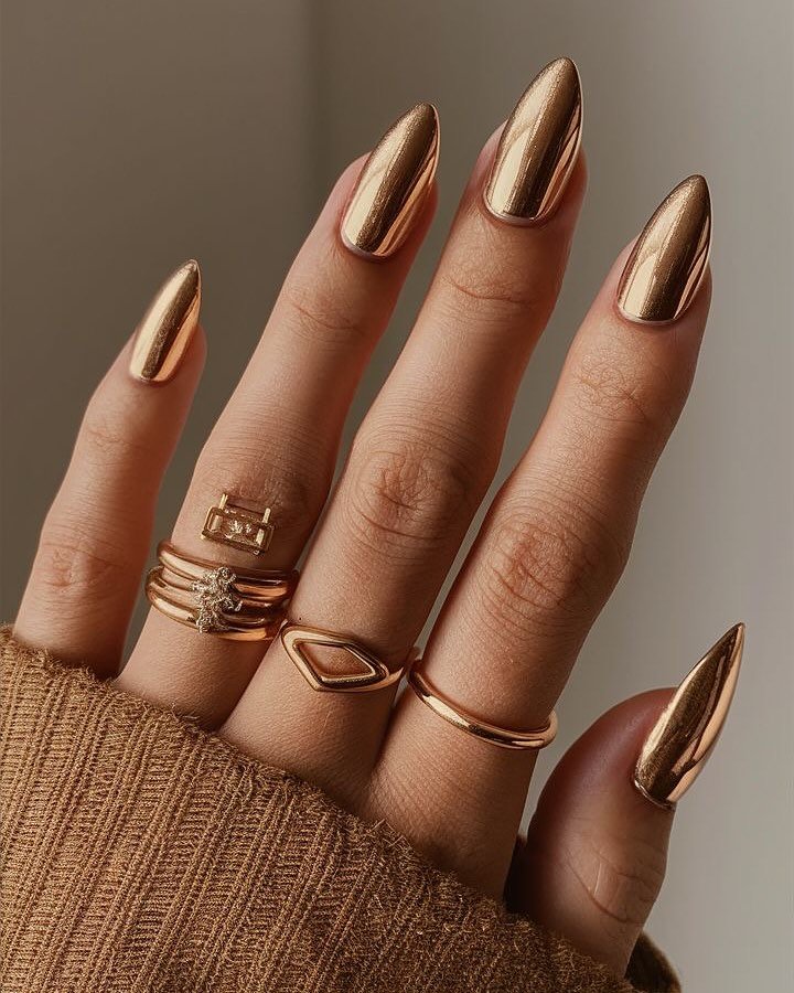 Long Bronze Almond Nails with a Polished Metallic Finish
