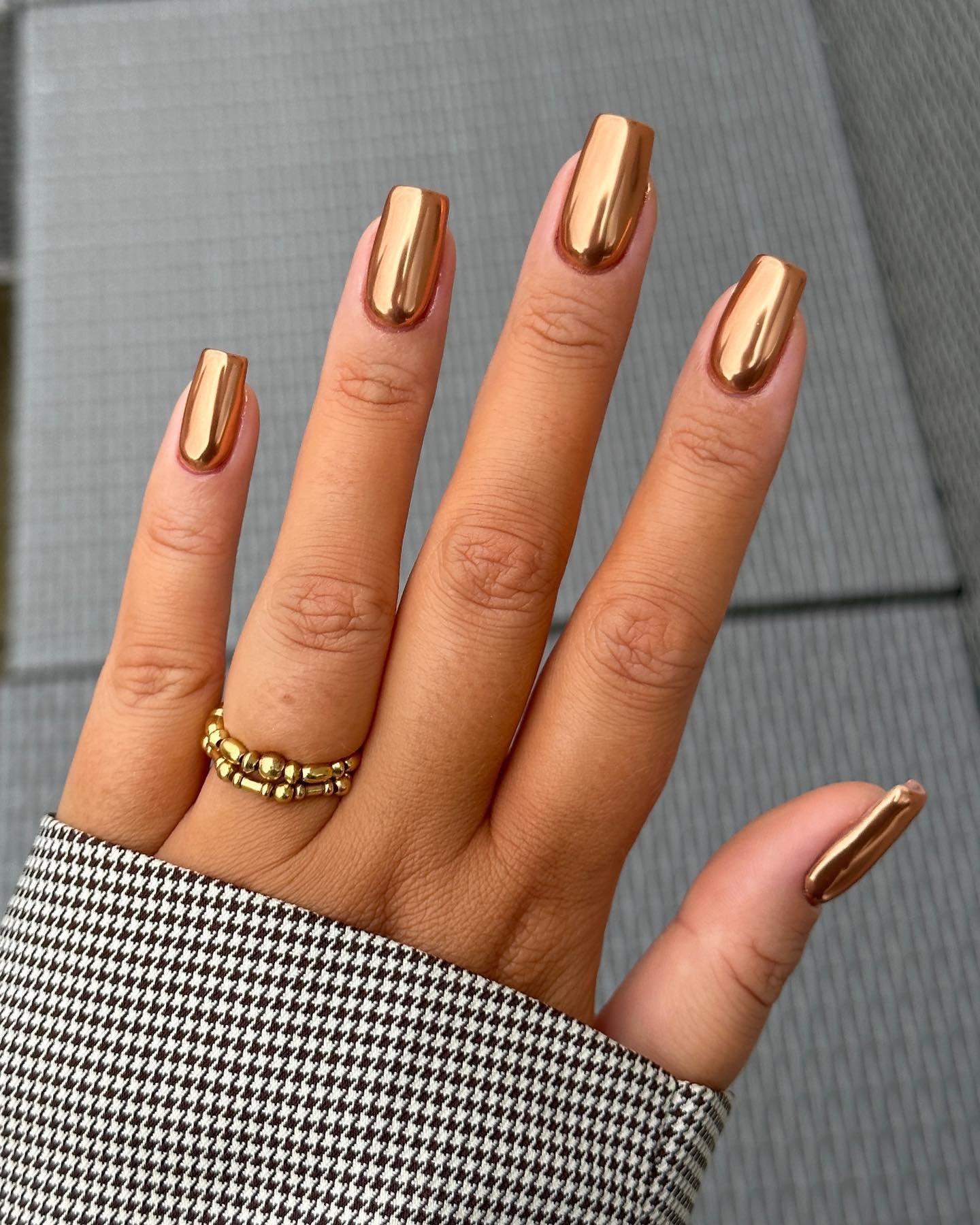 Copper Bronze Almond Nails with a Bright Metallic Finish