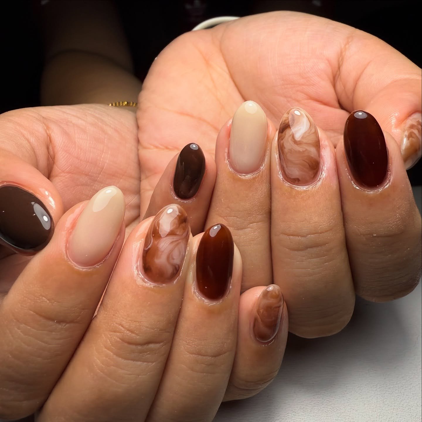 Mixed Nude, Brown, and Tortoiseshell Almond Nails