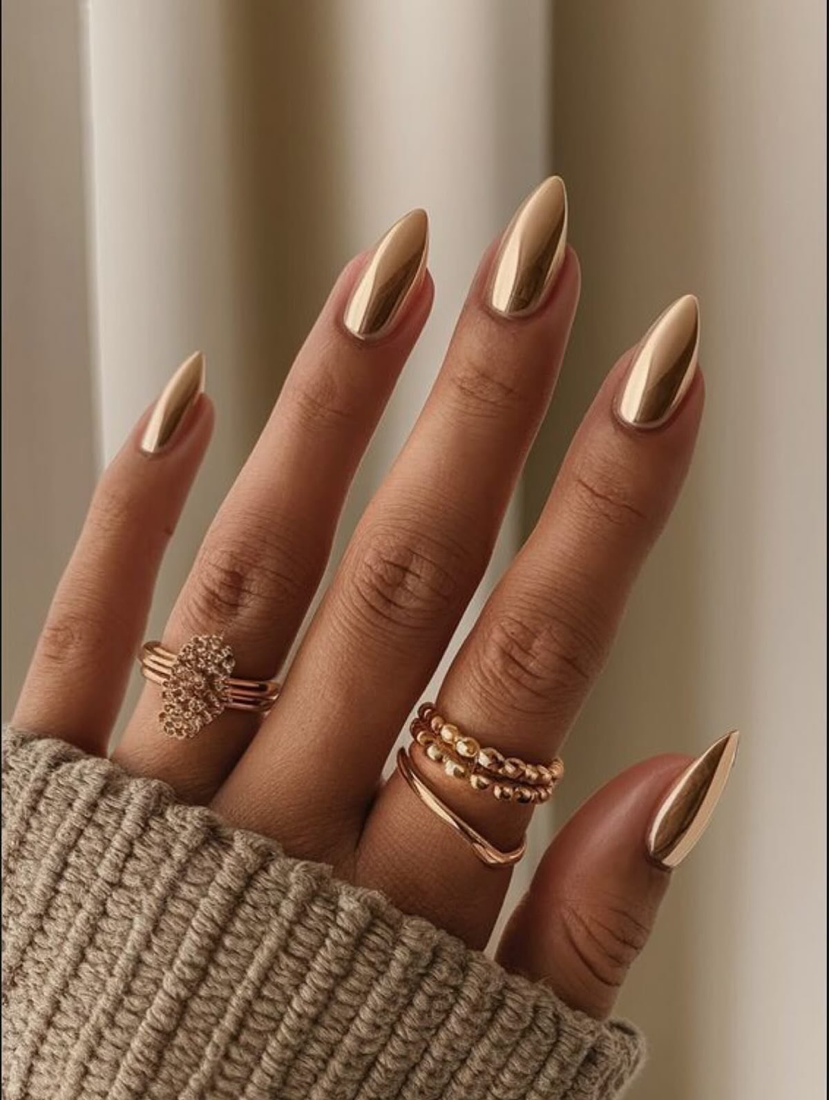 Long Bronze Almond Nails with a Soft Metallic Finish