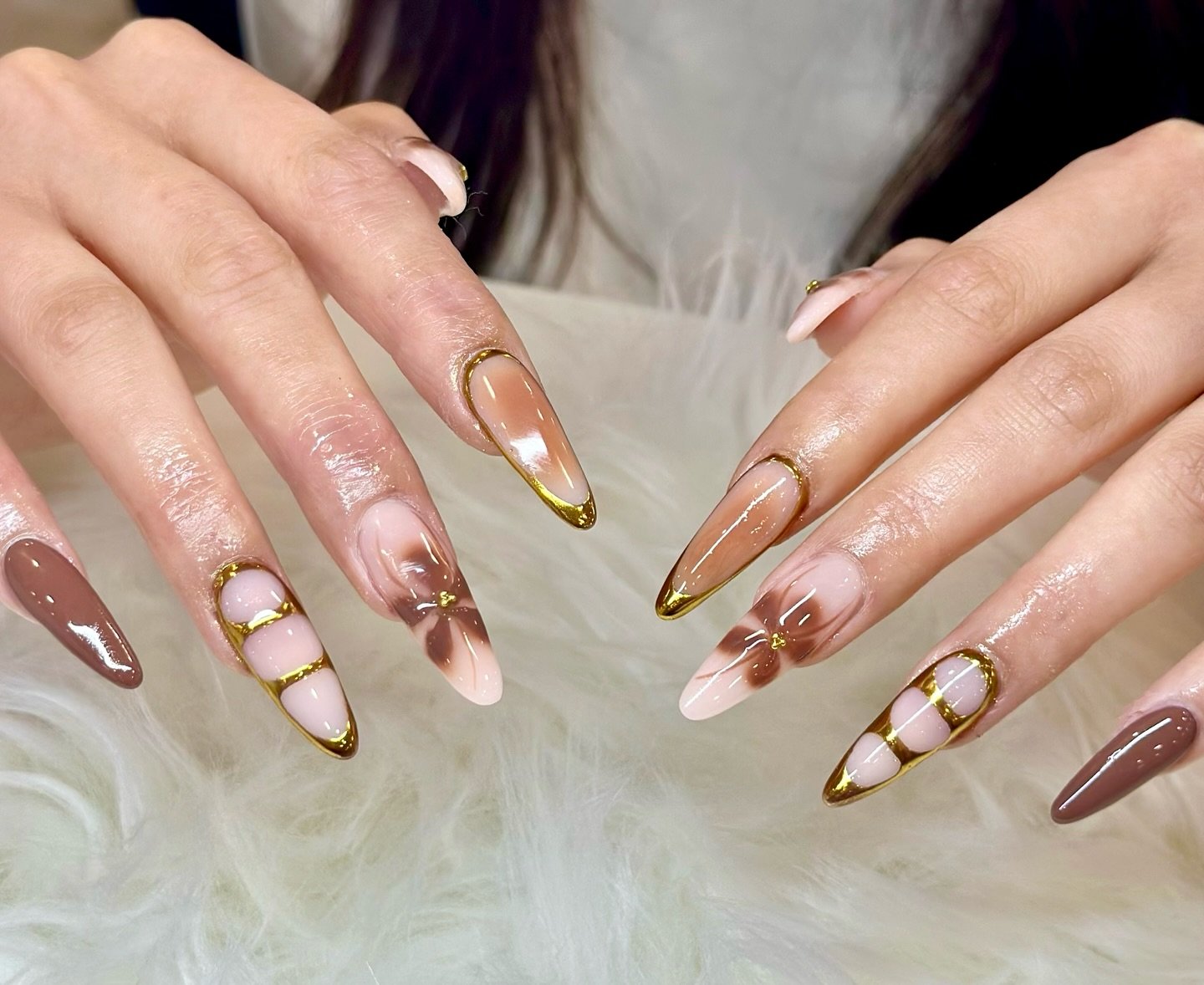 Nude Almond Nails with Bronze and Gold Linework