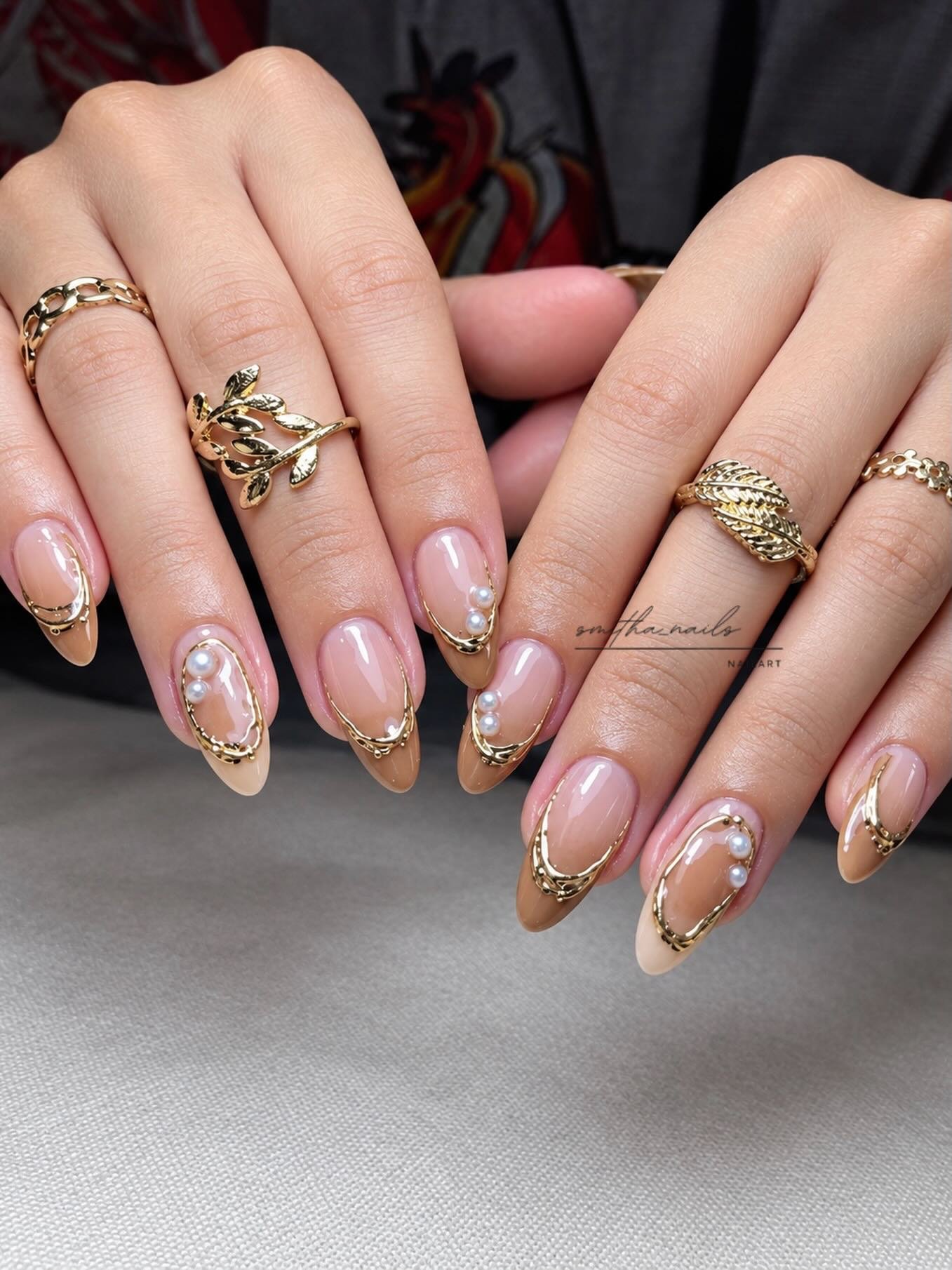 Nude Almond Nails with Bronze Glitter Details