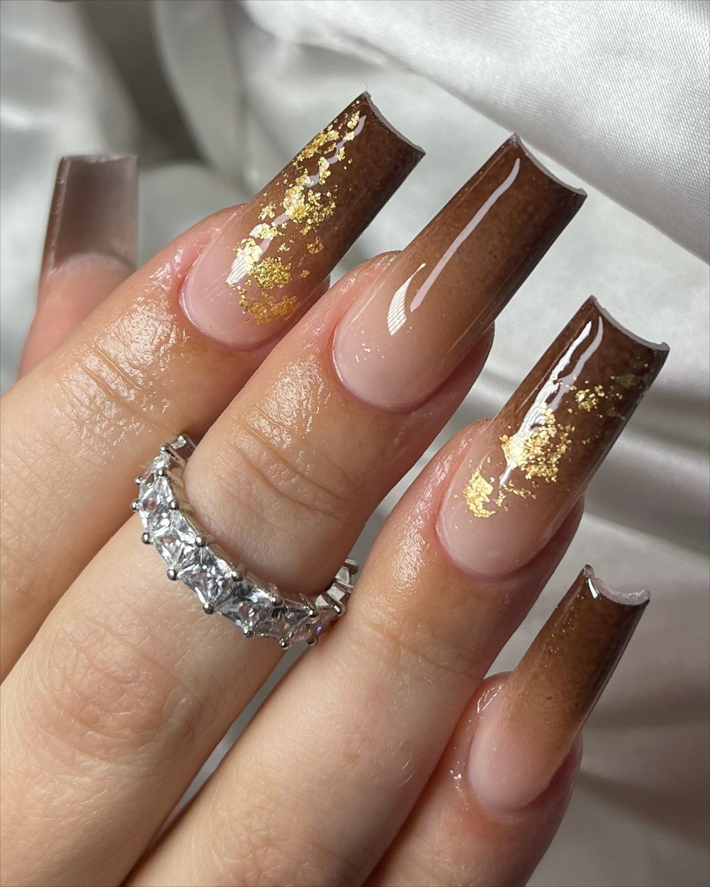Nude Almond Nails with Dark Bronze Glitter Tips