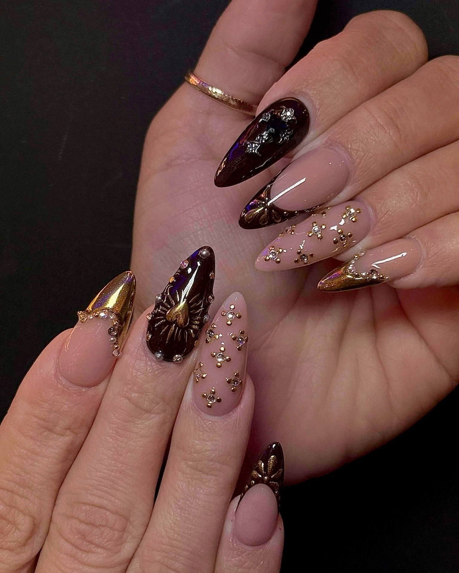 Brown Chrome Nails with Gold and Black Accents