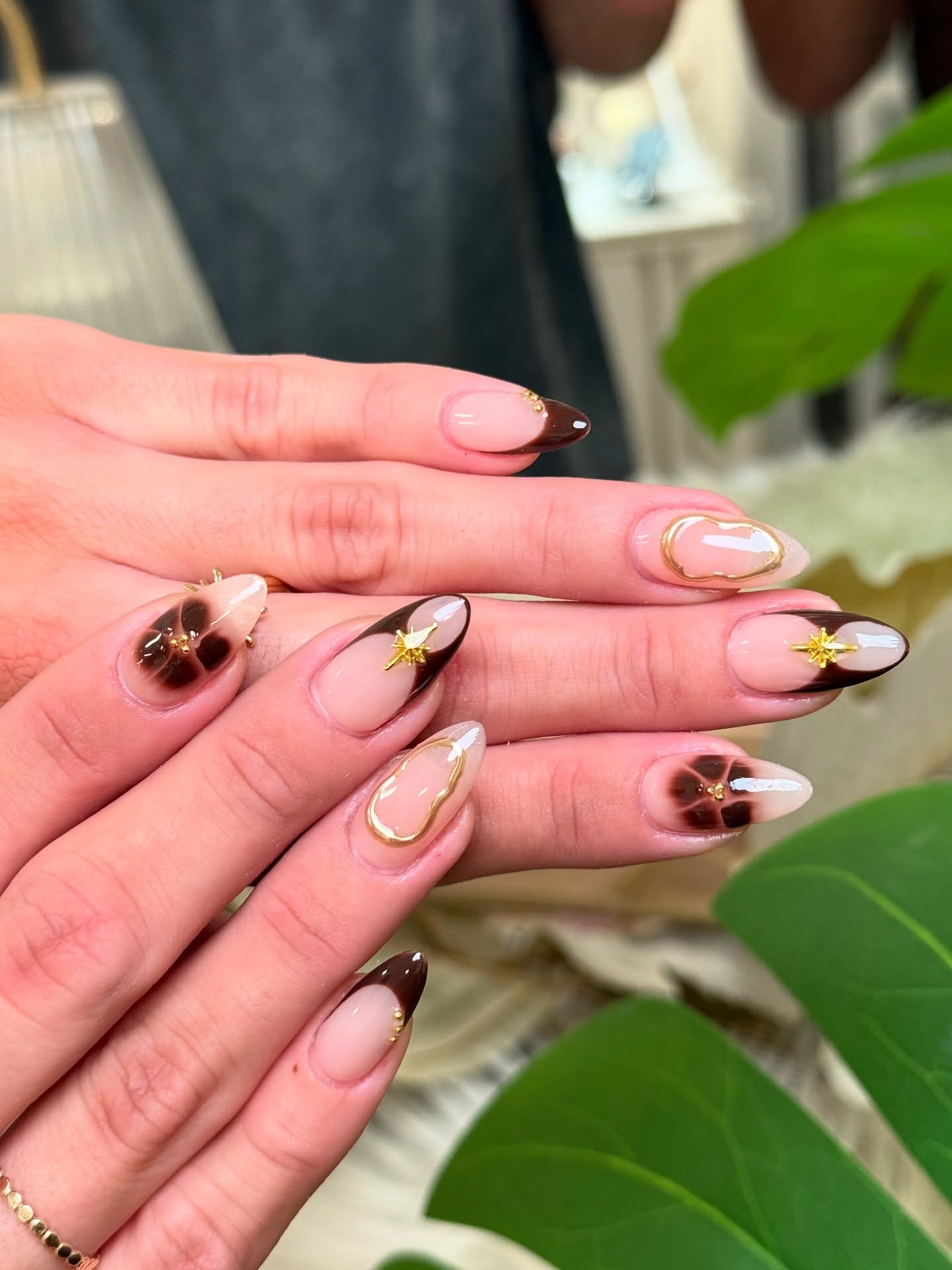 Brown Chrome Nails with Small Decorative Accents