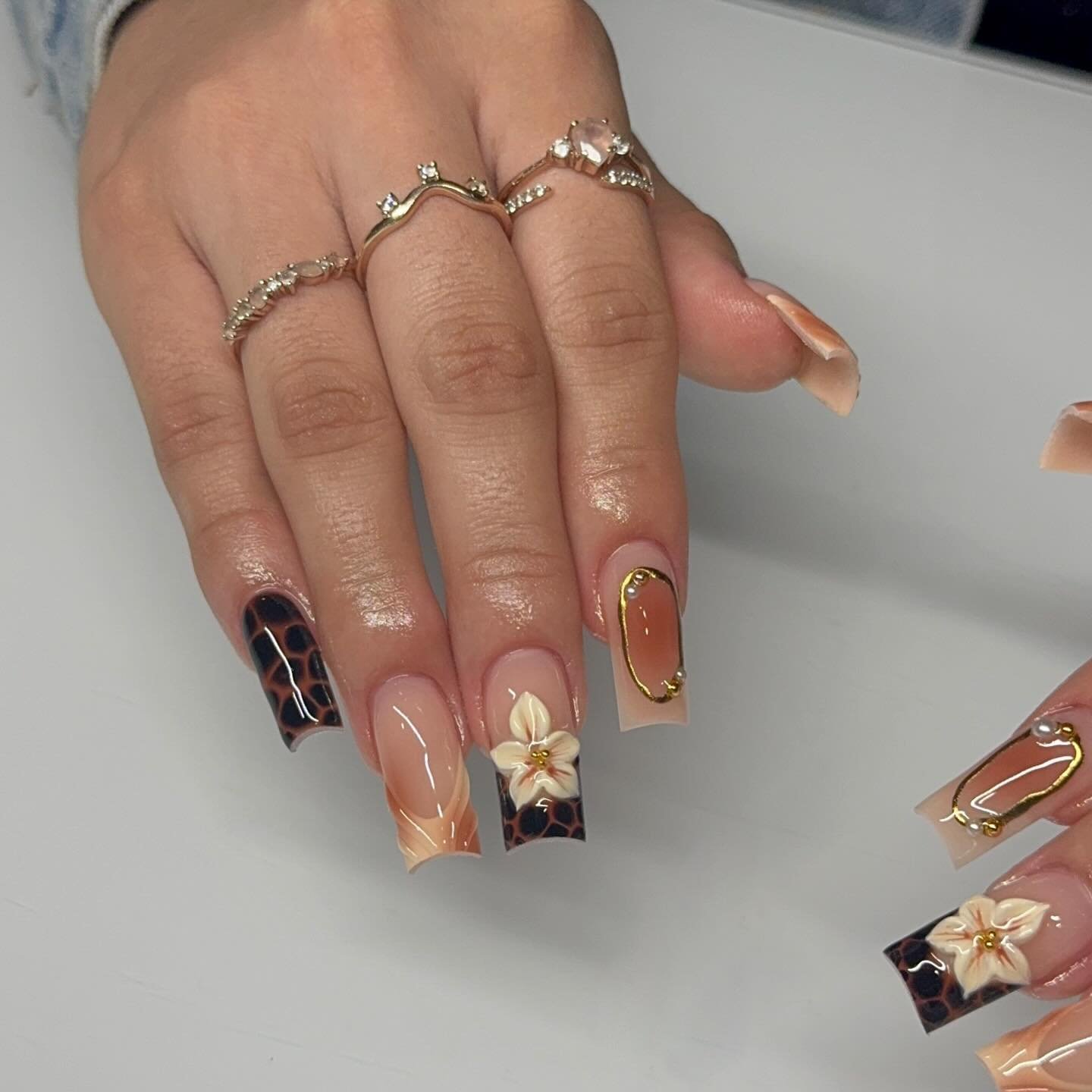 Brown Chrome Nails with Floral Accent Details