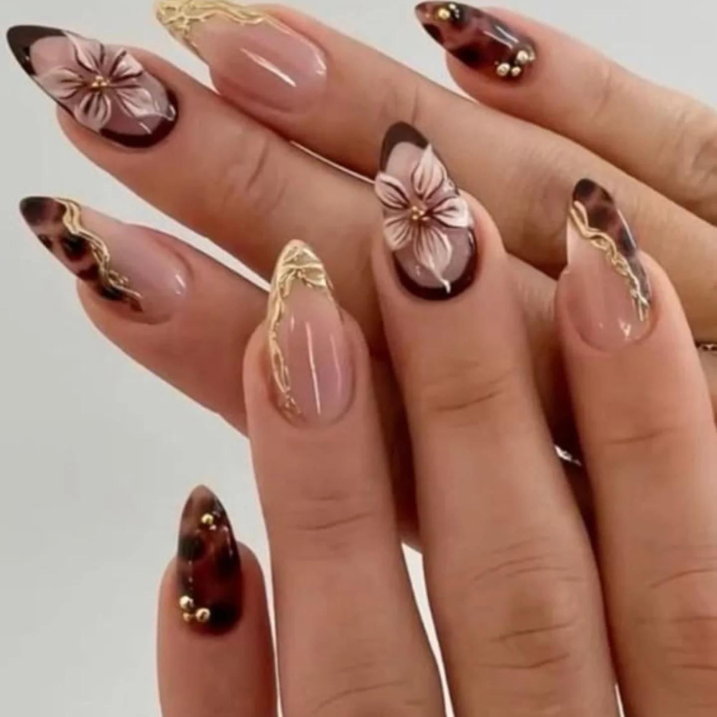 Brown Chrome Almond Nails with Floral Details