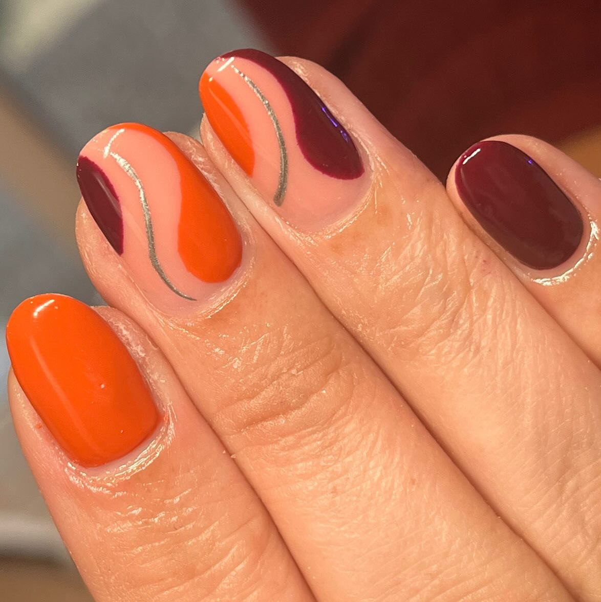 Orange and Deep Wine Curved Accent Nails