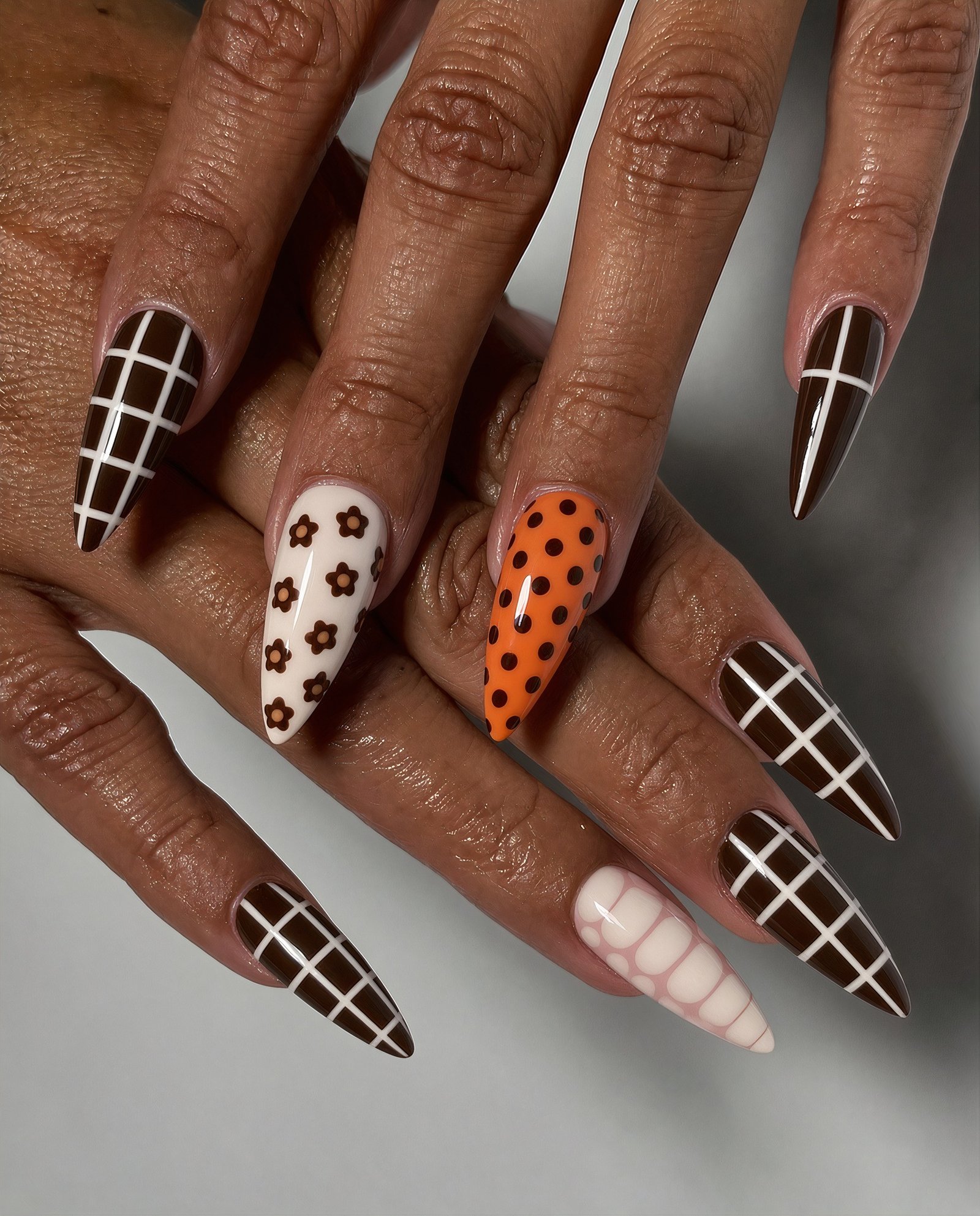 Black, Brown, Orange, and Leopard Grid Nails