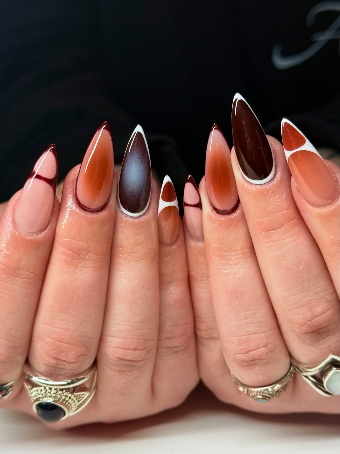 Glossy Brown and Orange Stiletto Nails