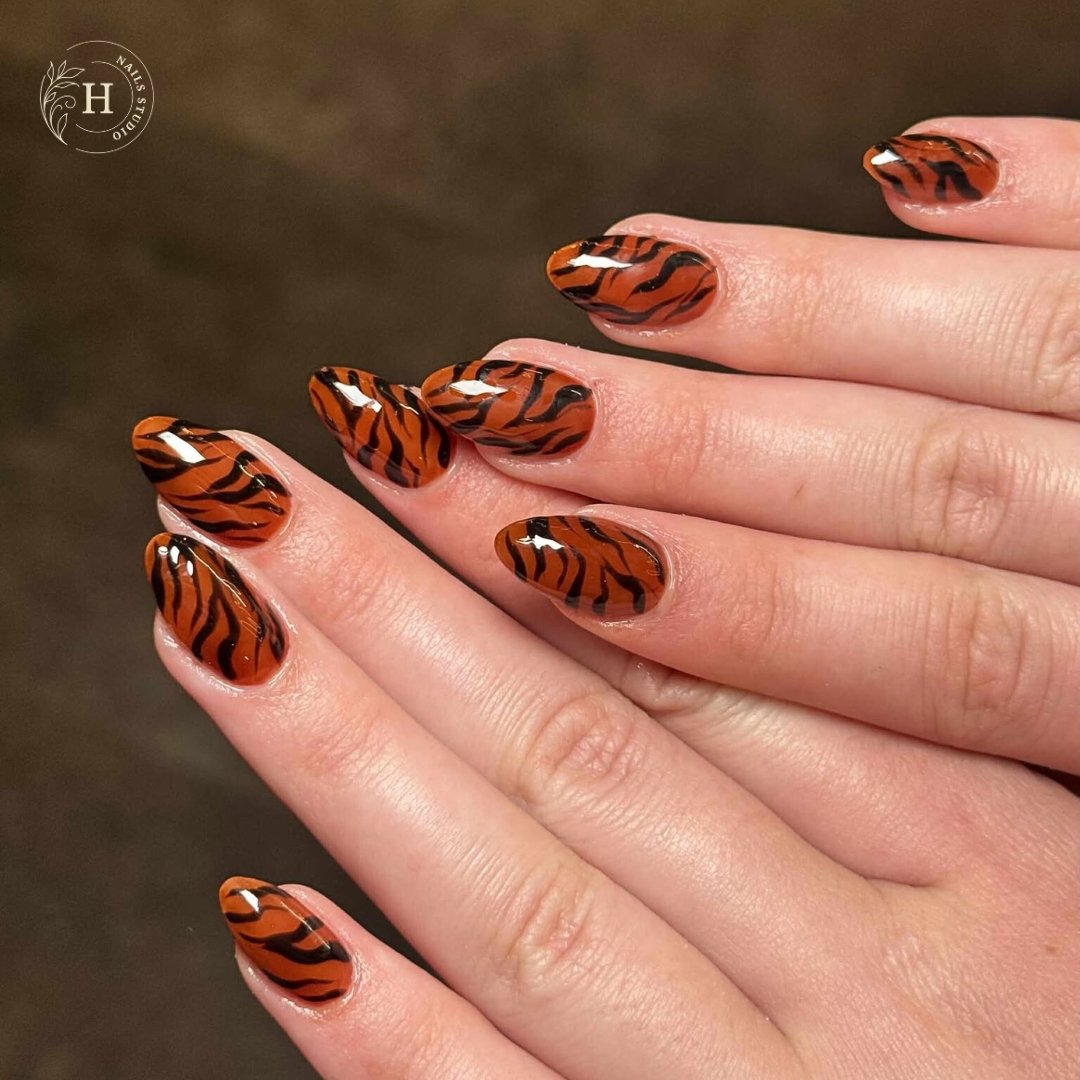 Brown Tiger-Stripe and Orange Accent Nails