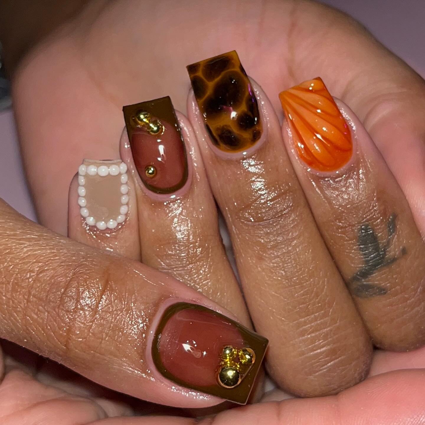 Orange and Brown Nails with White Botanical Accents