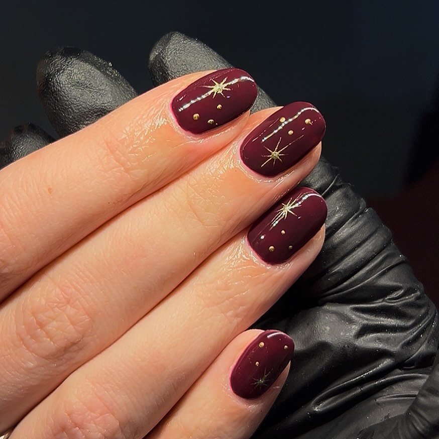 Short Burgundy Nails with Tiny Gold Star Details — DSktyWLiFo5Erin Mae Nail Technician.jpg