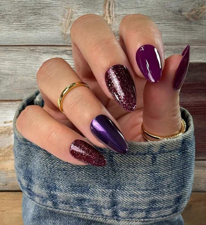 Glossy Plum Nails with a Sparkly Accent