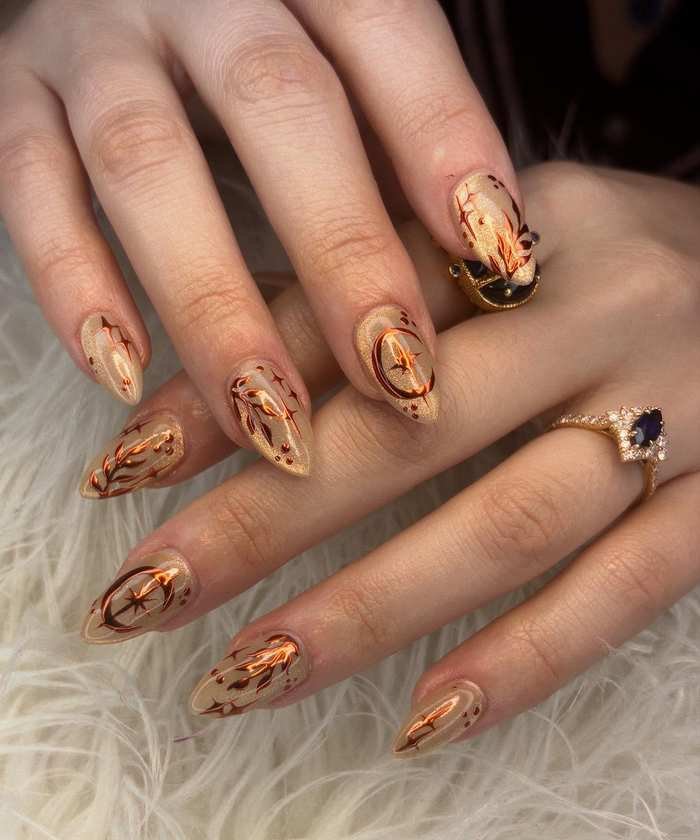 Almond Nails with Warm Brown Swirls and Gold Details