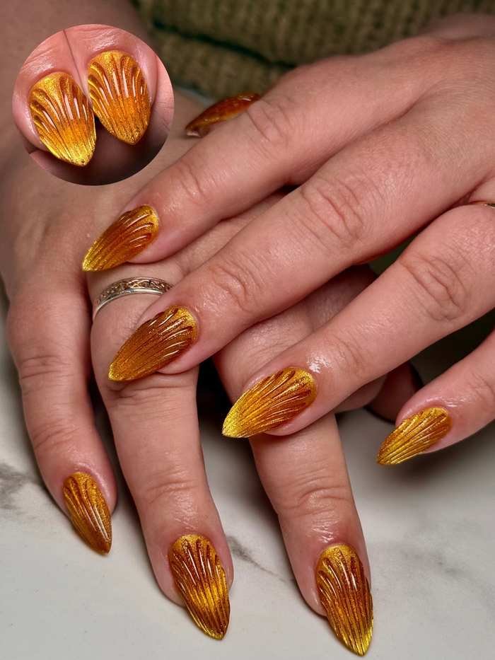 Long Almond Nails with Brown and Gold Swirl Accents