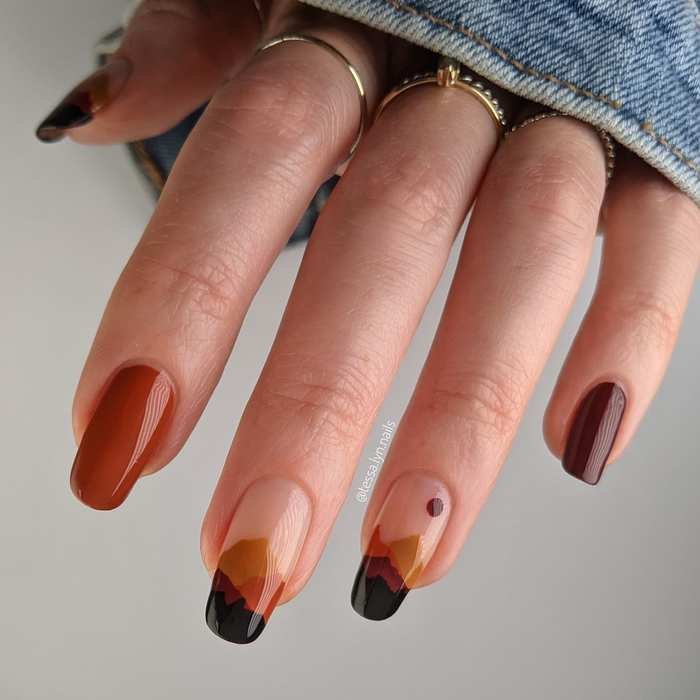Burnt Orange Almond Nails with Black-Tipped Accents