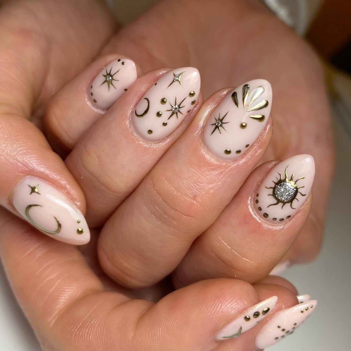 Blush Almond Nails with Black Star and Sun Motifs — Cm4K1ZSspjPJess.jpg